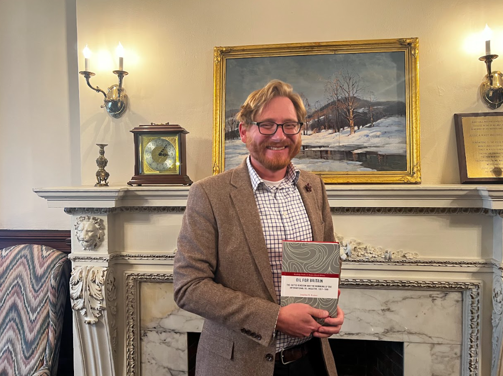 Dr. Kuiken poses with his new book, “Oil for Britain: The United Kingdom and the Remaking of the International Oil Industry, 1957-1988.”