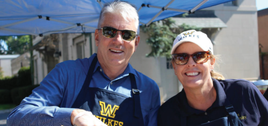 Wilkes President Gred Cant and his wife, Angela, take a break from serving sausages to pose for a quick photo.