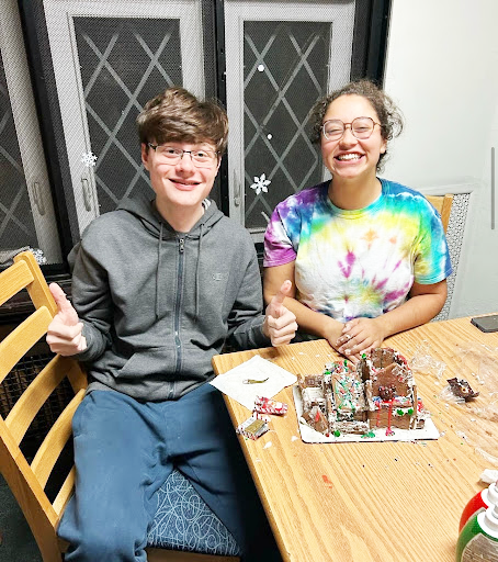 Waller Hall residents Luke Mauro (L) and Kensy Edmond (R.) celebrate the
holiday season with a pop-up party sponsored by RHC.