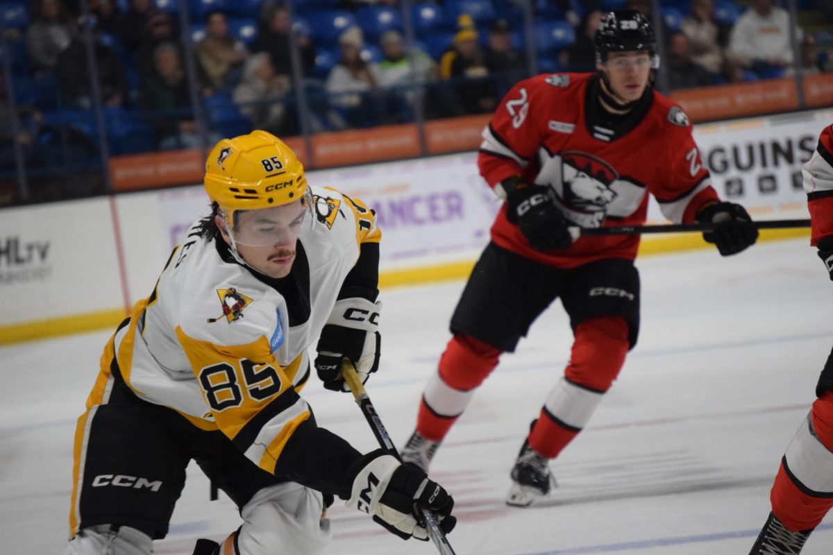 Avery Hayes with the puck in the offensive zone against the Charlotte Checkers on Dec. 14, 2025