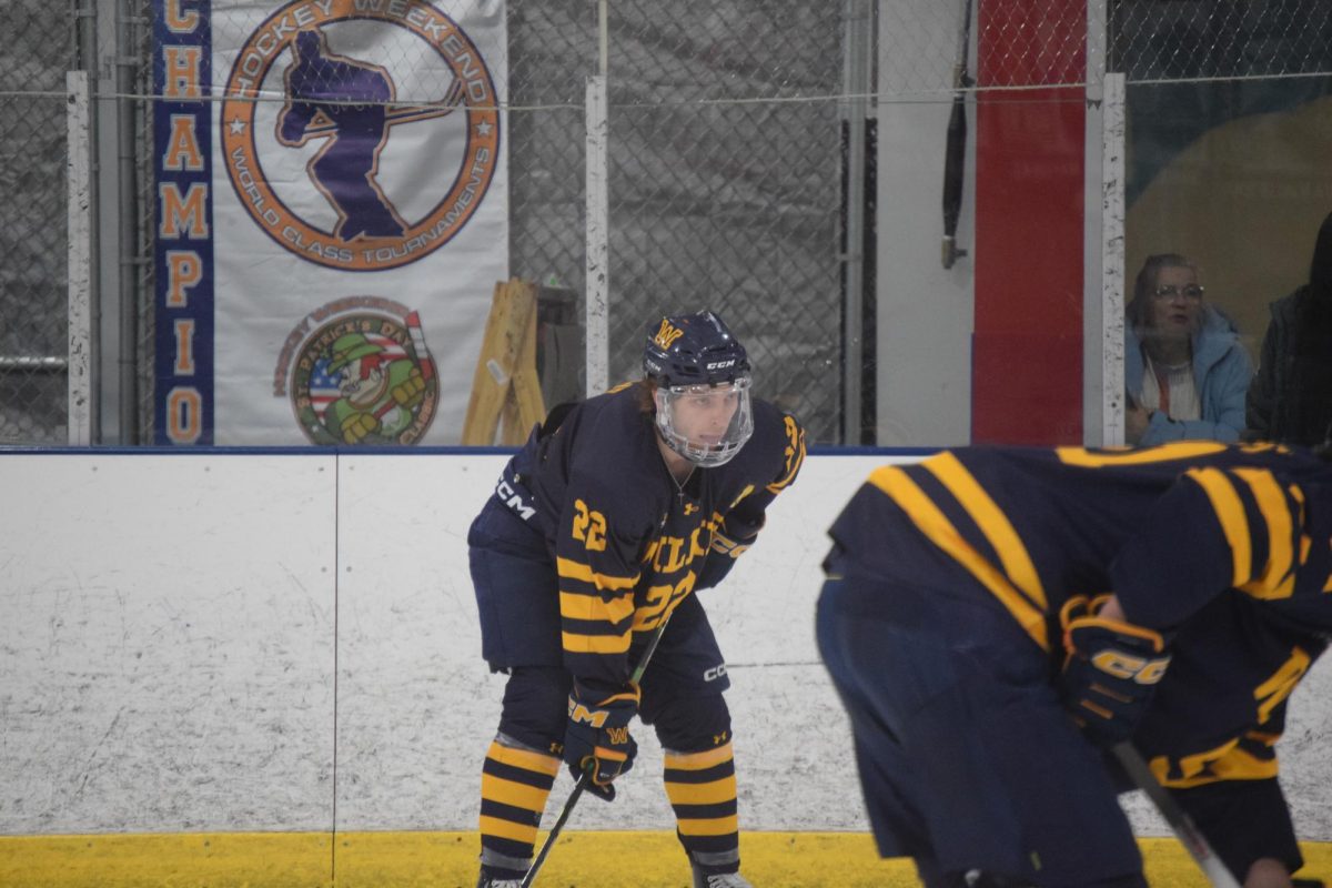Cam Lowe lines up for a faceoff.