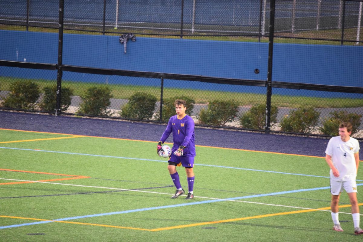 Goalkeeper Matthew Conti prepares for a goal kick against Marywood. 